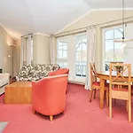 In A Lakeside Park In With A Balcony